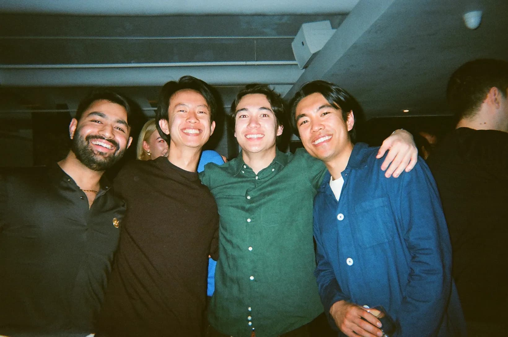 Four Rogo teammates with their arms around each other on a night out